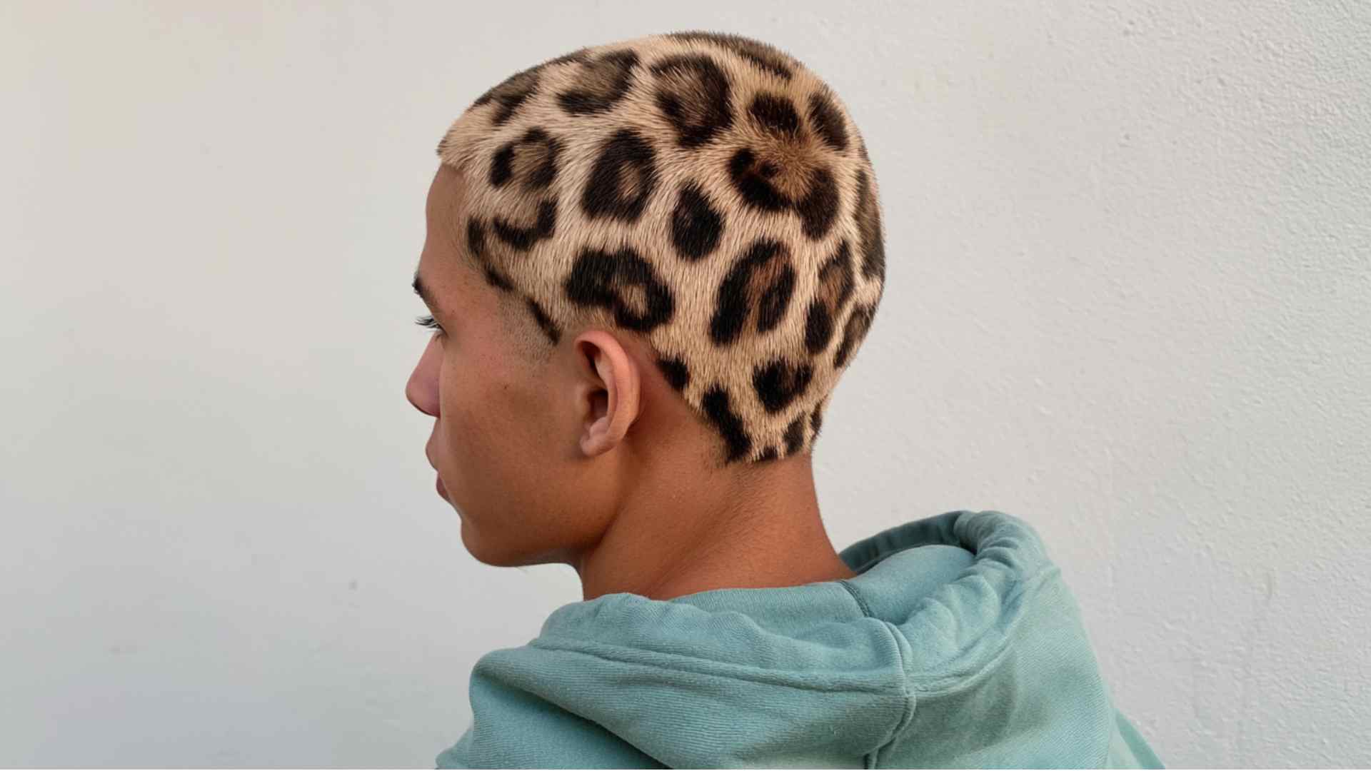 Very short buzz cut featuring a shaved graphic line detail