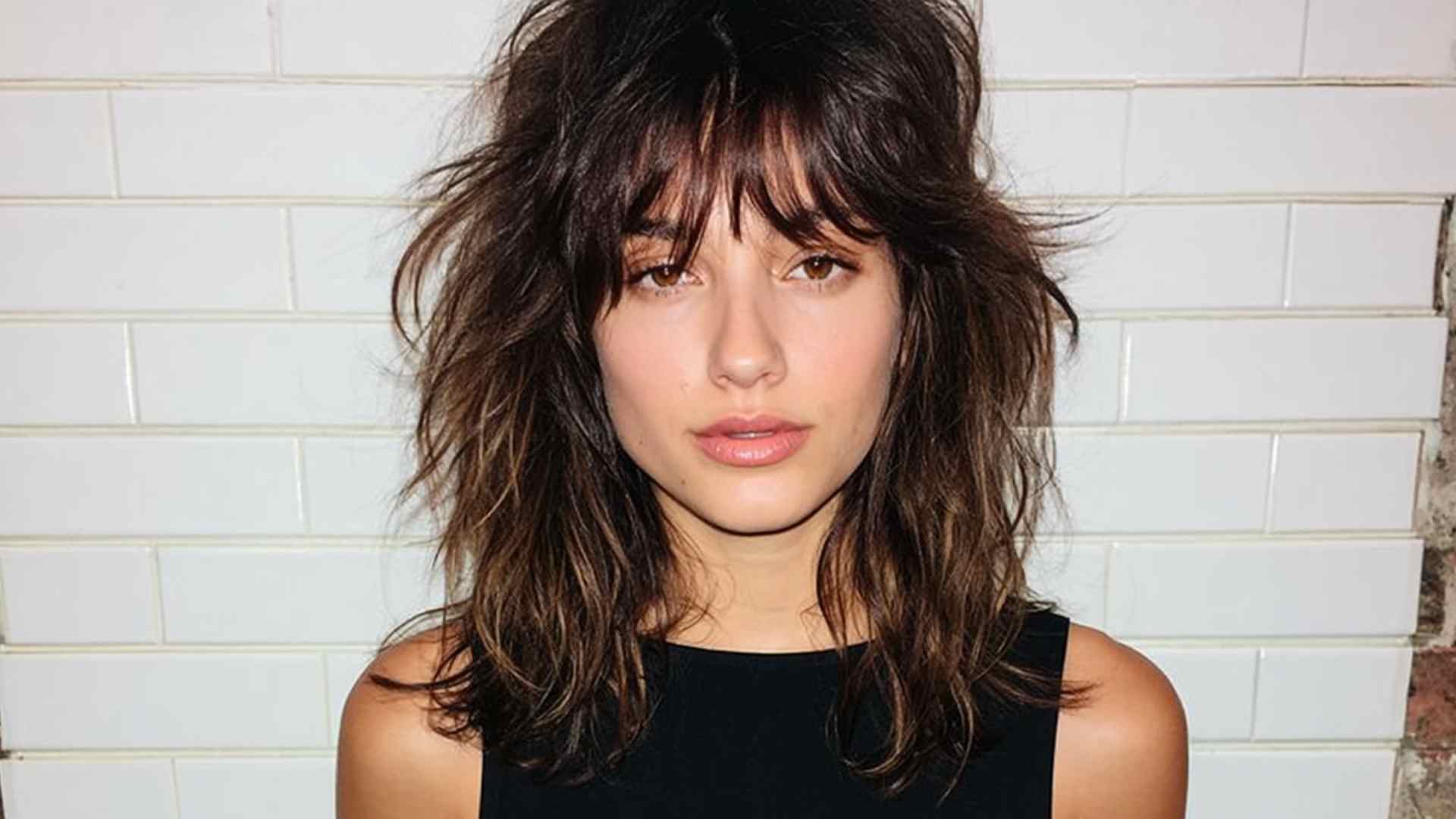 Chin-length grunge shag with messy layers and undone wavy texture