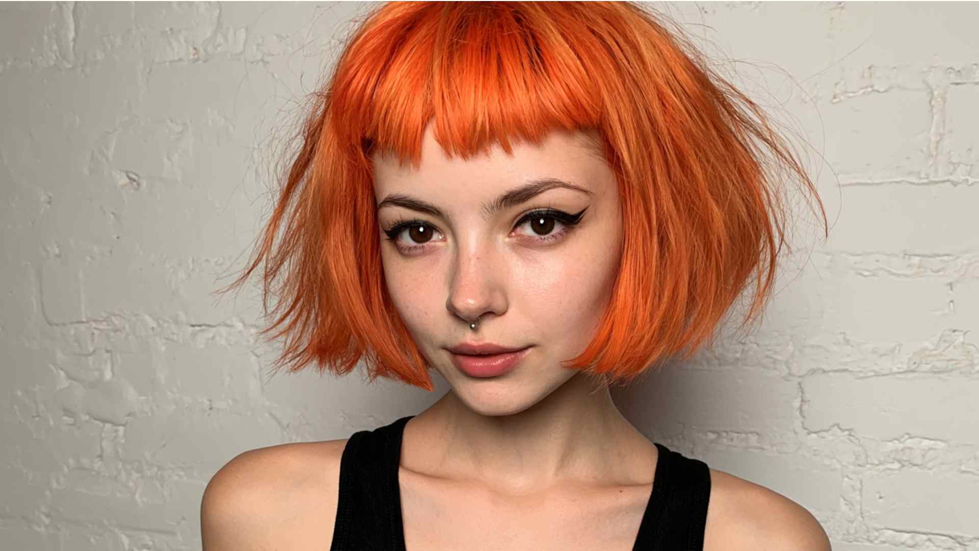 Choppy short bob with rough layers and unconventional micro bangs
