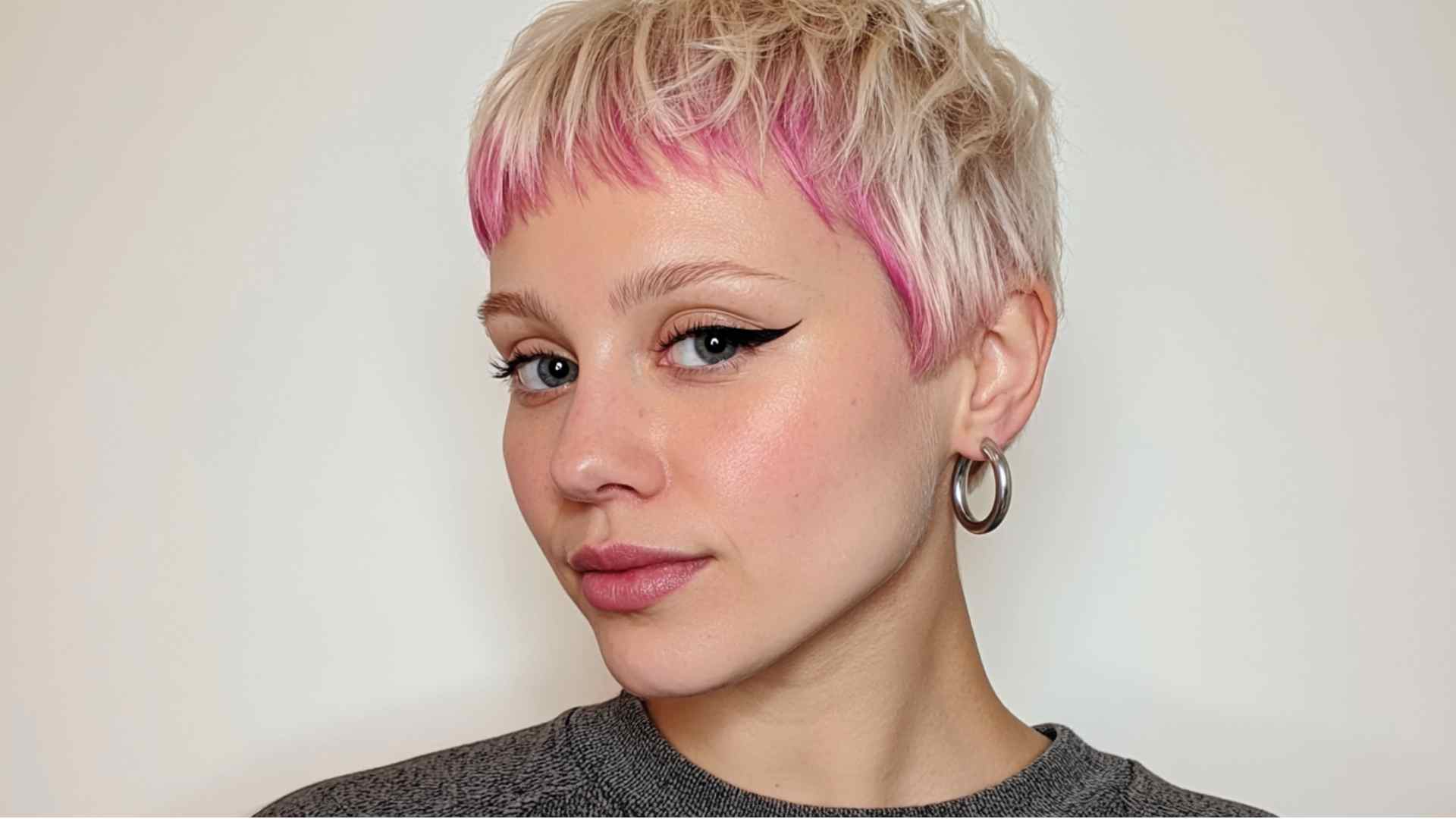 Short pixie with contrasting color blocks emphasizing the haircut's shape