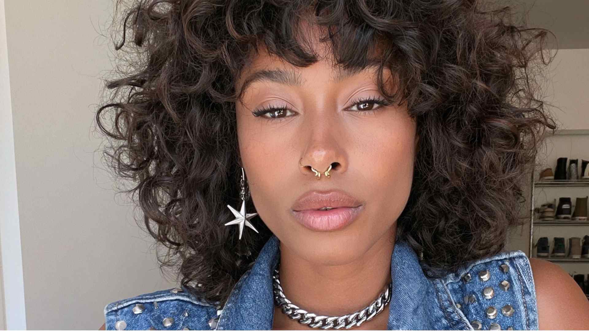 Curly short mullet with natural curls adding volume to the longer back