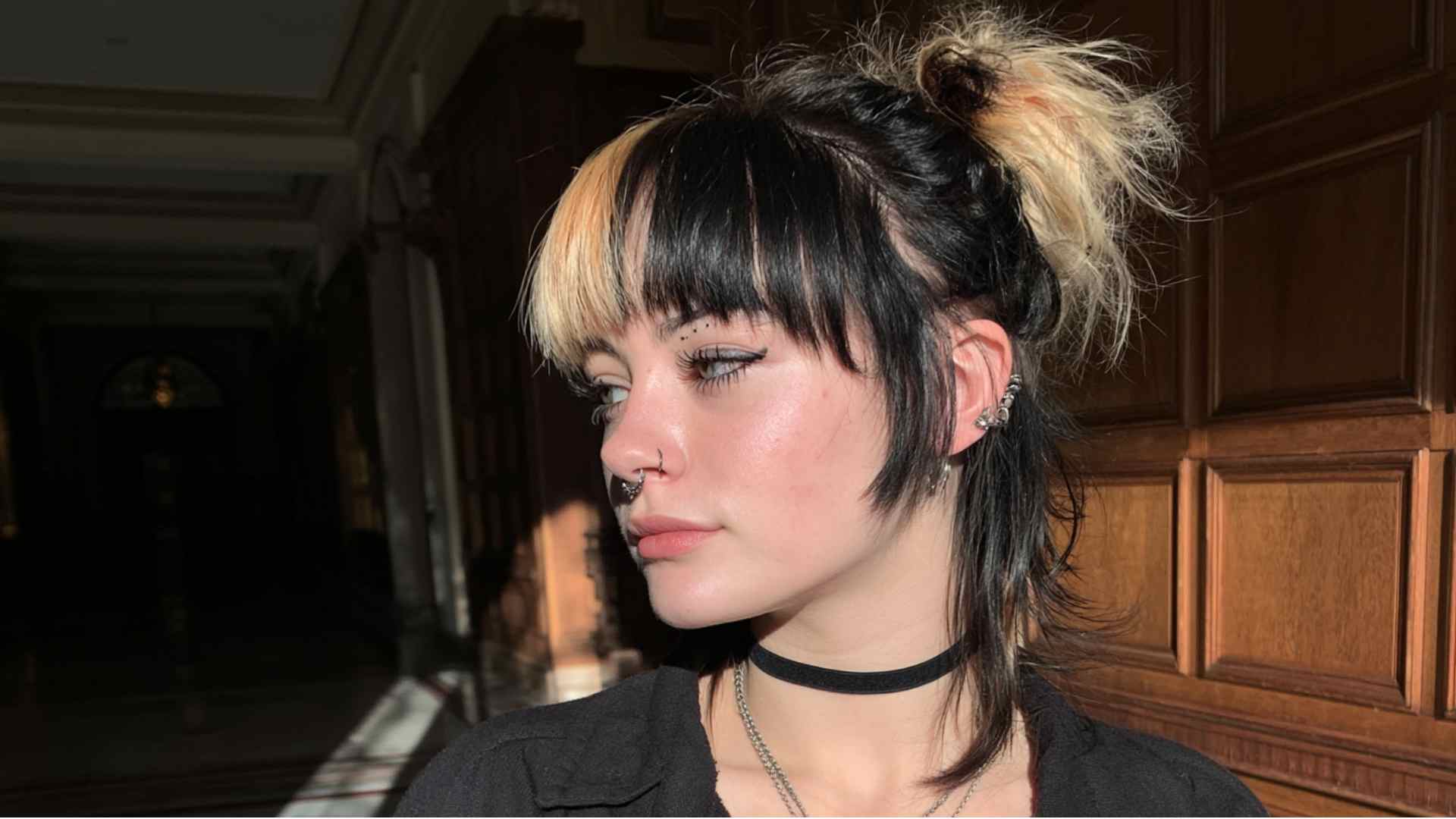 Dark grunge hair with lighter lengths and visible grown out roots