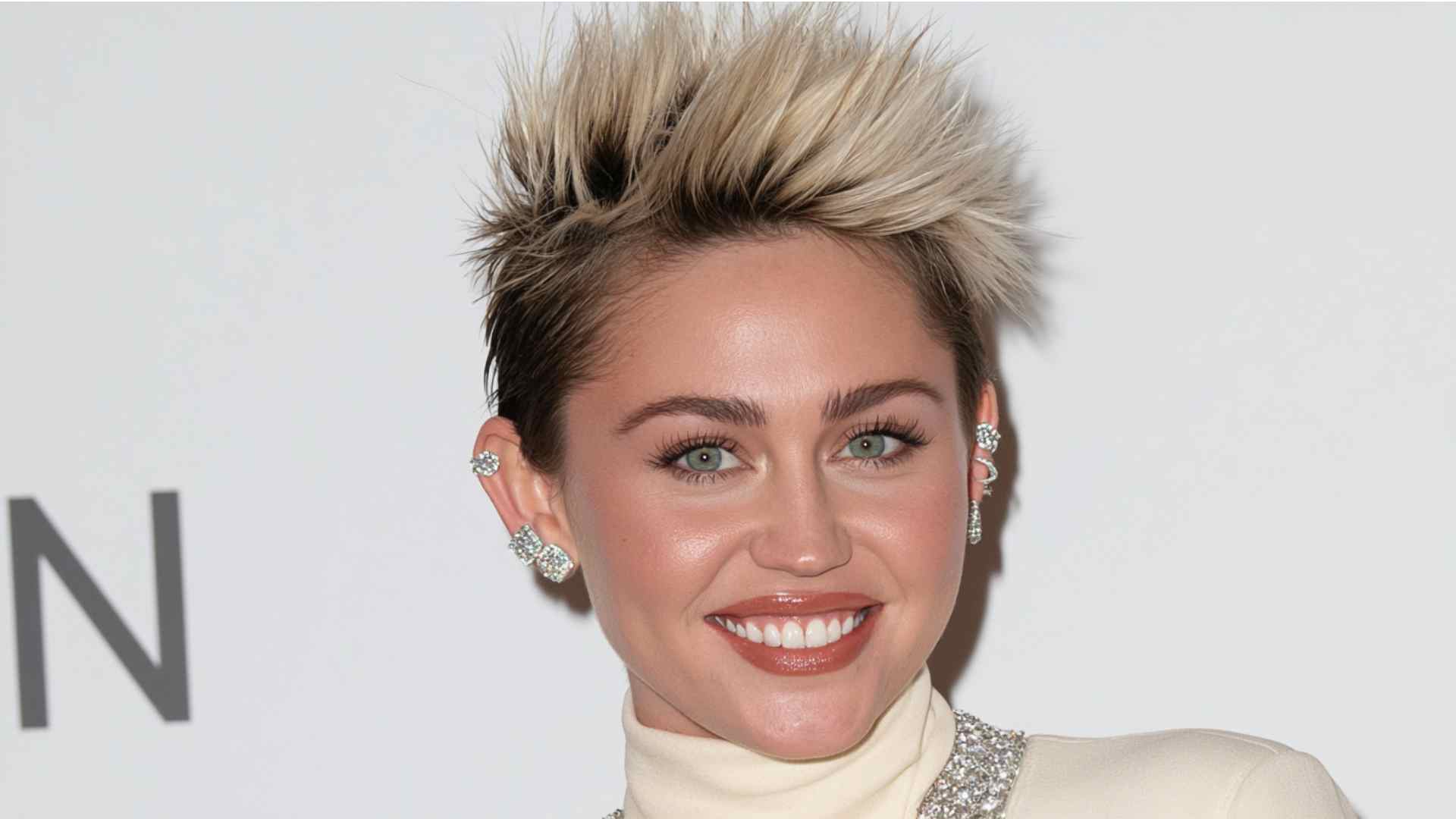 Short faux hawk crop with raised center texture and closely trimmed sides