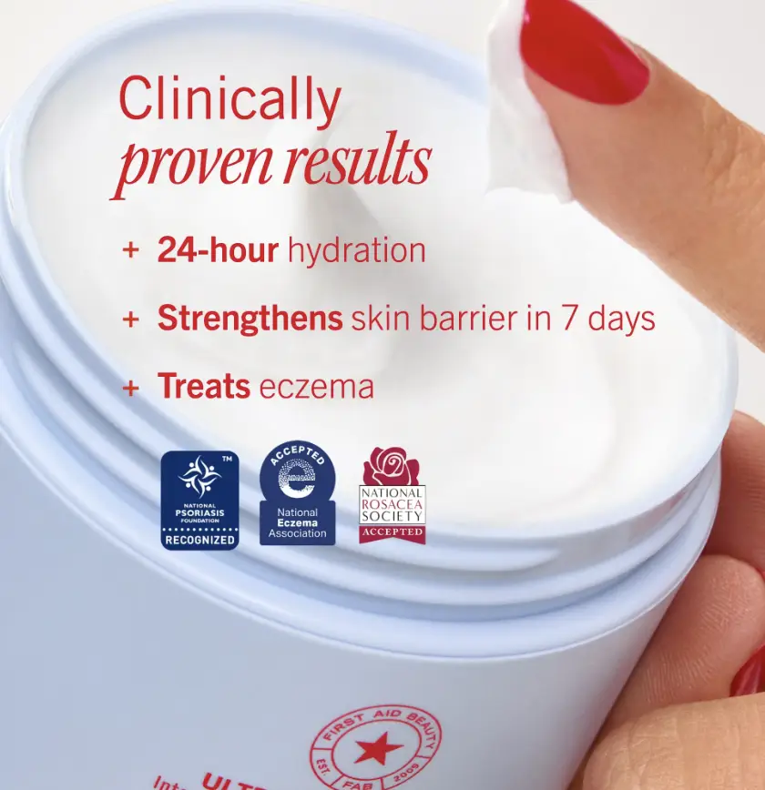 Open jar of white cream with finger scooping product, red nail polish visible