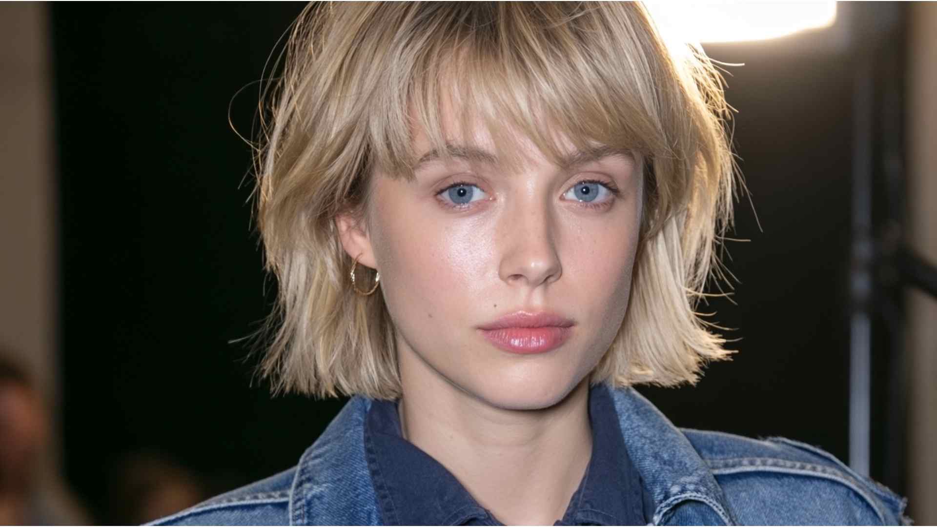 Grown-out grunge pixie haircut with uneven layers, longer sides, and messy textured pieces