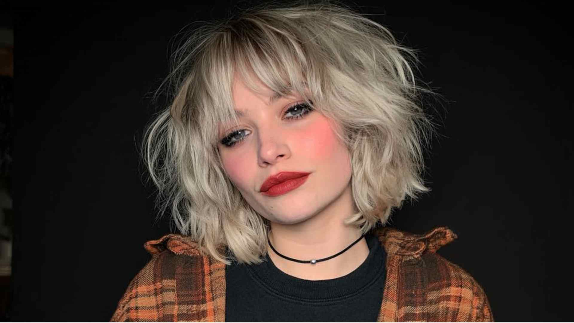 Short grunge bob with piecey bangs and uneven layered ends