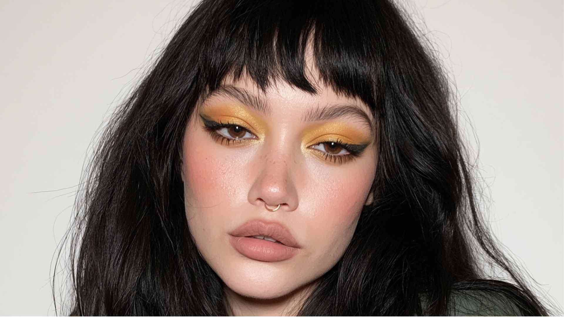 Grunge hairstyle with a choppy uneven fringe and loose layered lengths