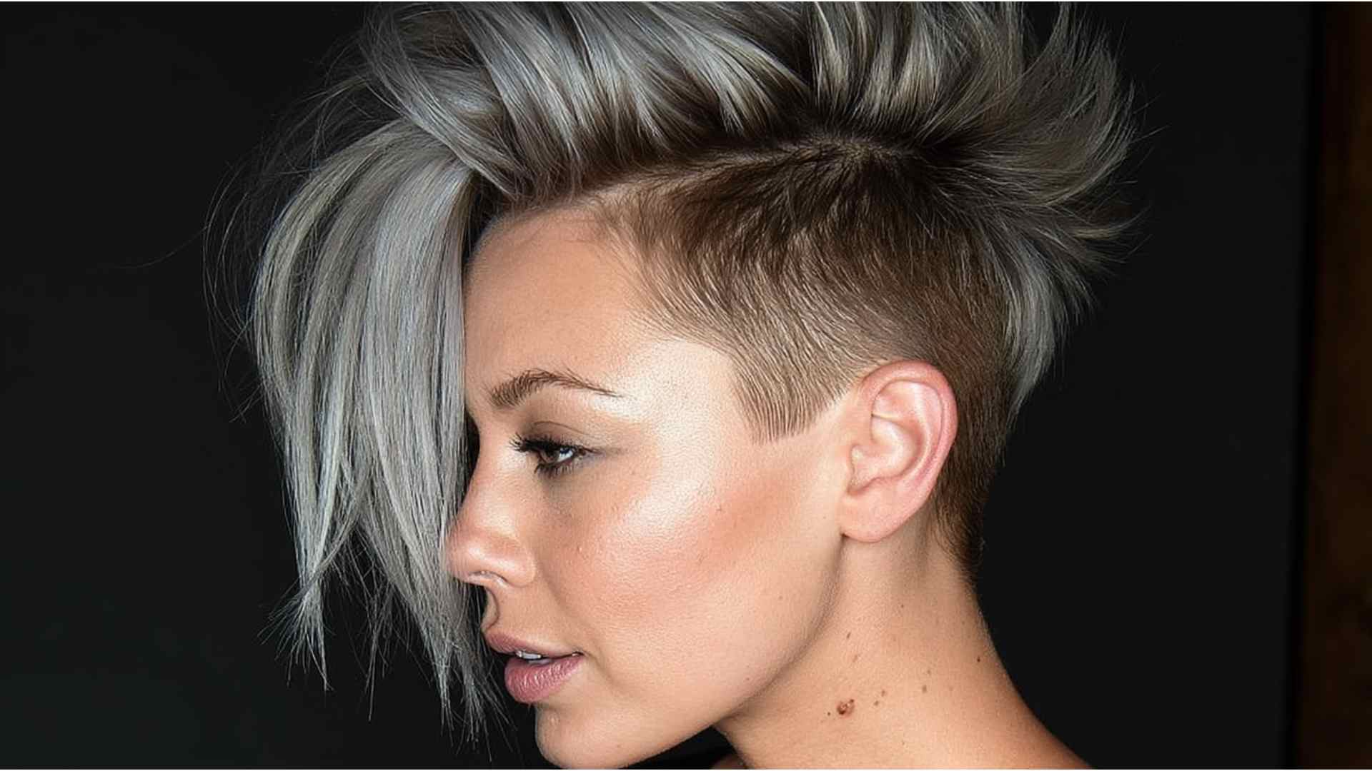 Grunge hairstyle with a shaved undercut and longer layered hair on top
