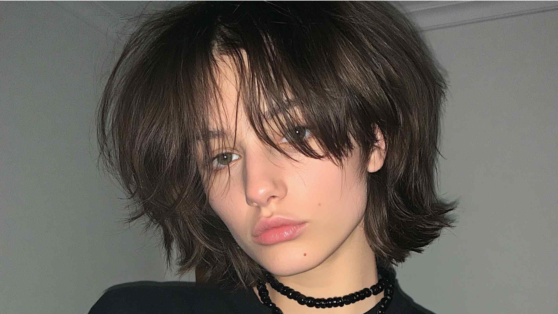 Grunge mullet with short choppy layers and longer hair at the back