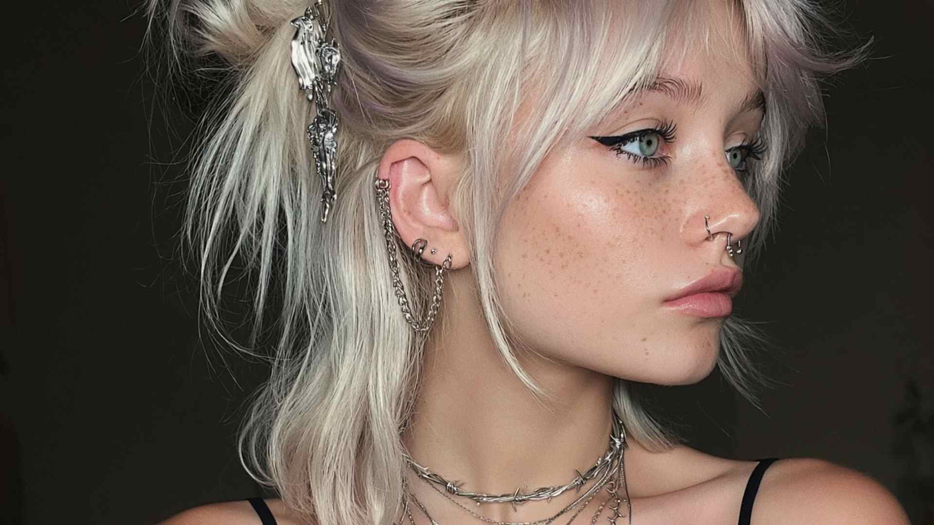 Half-up grunge hairstyle with messy volume, loose waves, and undone layered sections