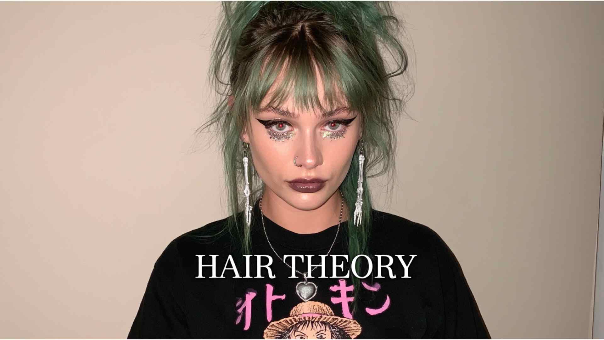 Hands styling layered grunge hair with a lightweight matte styling product