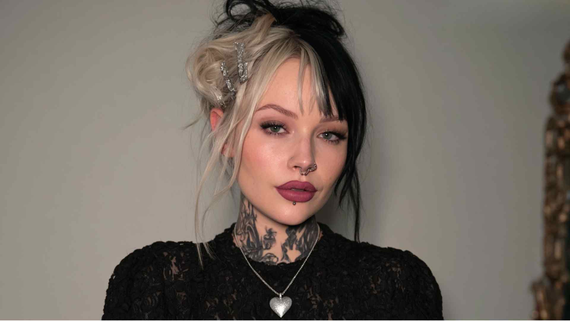 Loose grunge bun hairstyle with relaxed texture, messy flyaways, and loose front strands