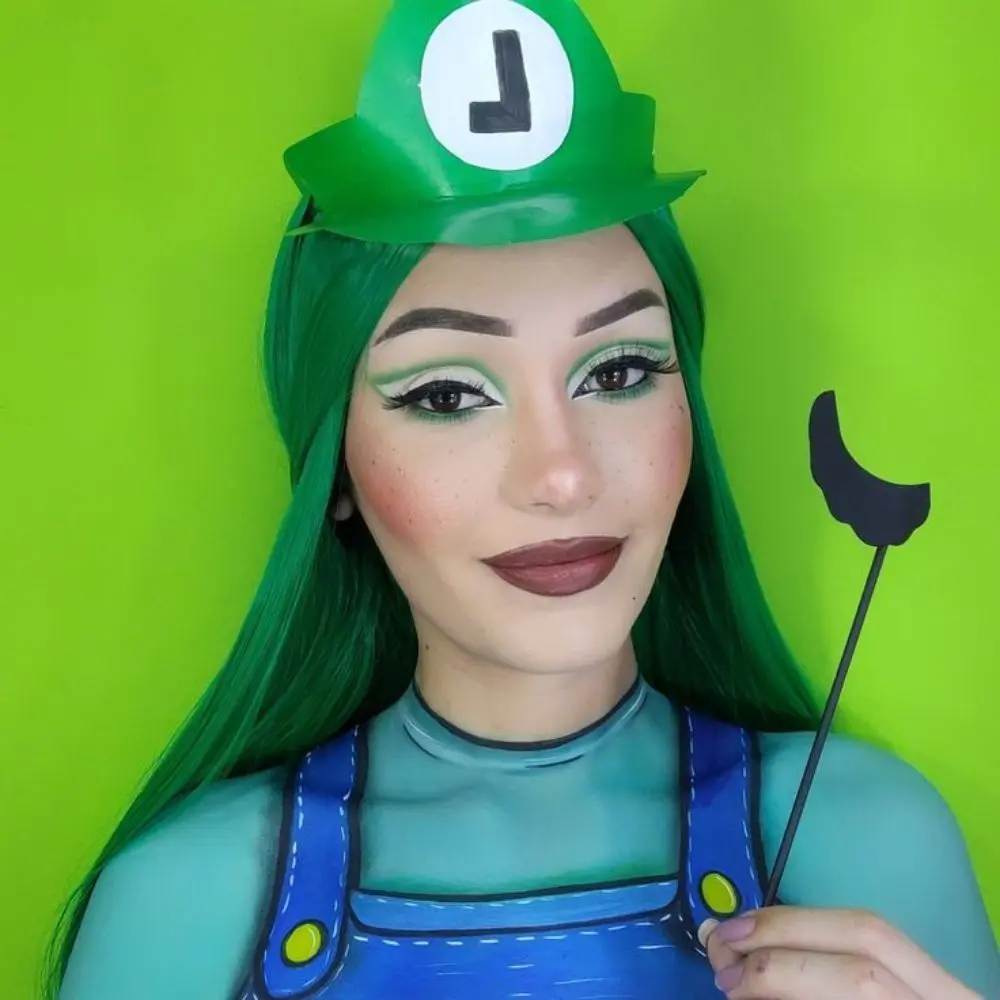 Luigi makeup with a soft green eye wash, neat black liner, a playful dark mustache, and a bright natural complexion