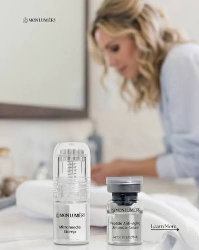 Skincare products on a bathroom counter with blurry figure in the background