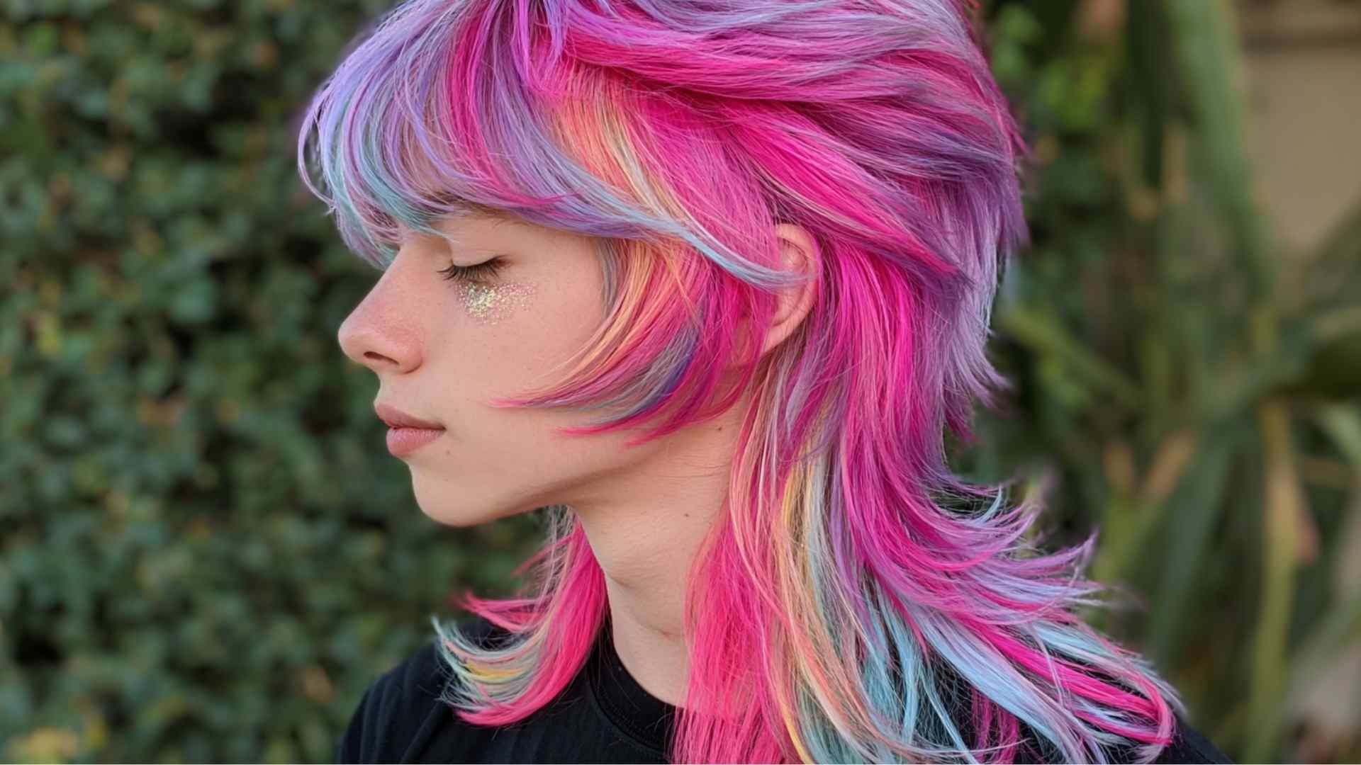 Choppy short shag accented with bright neon highlights through the layers