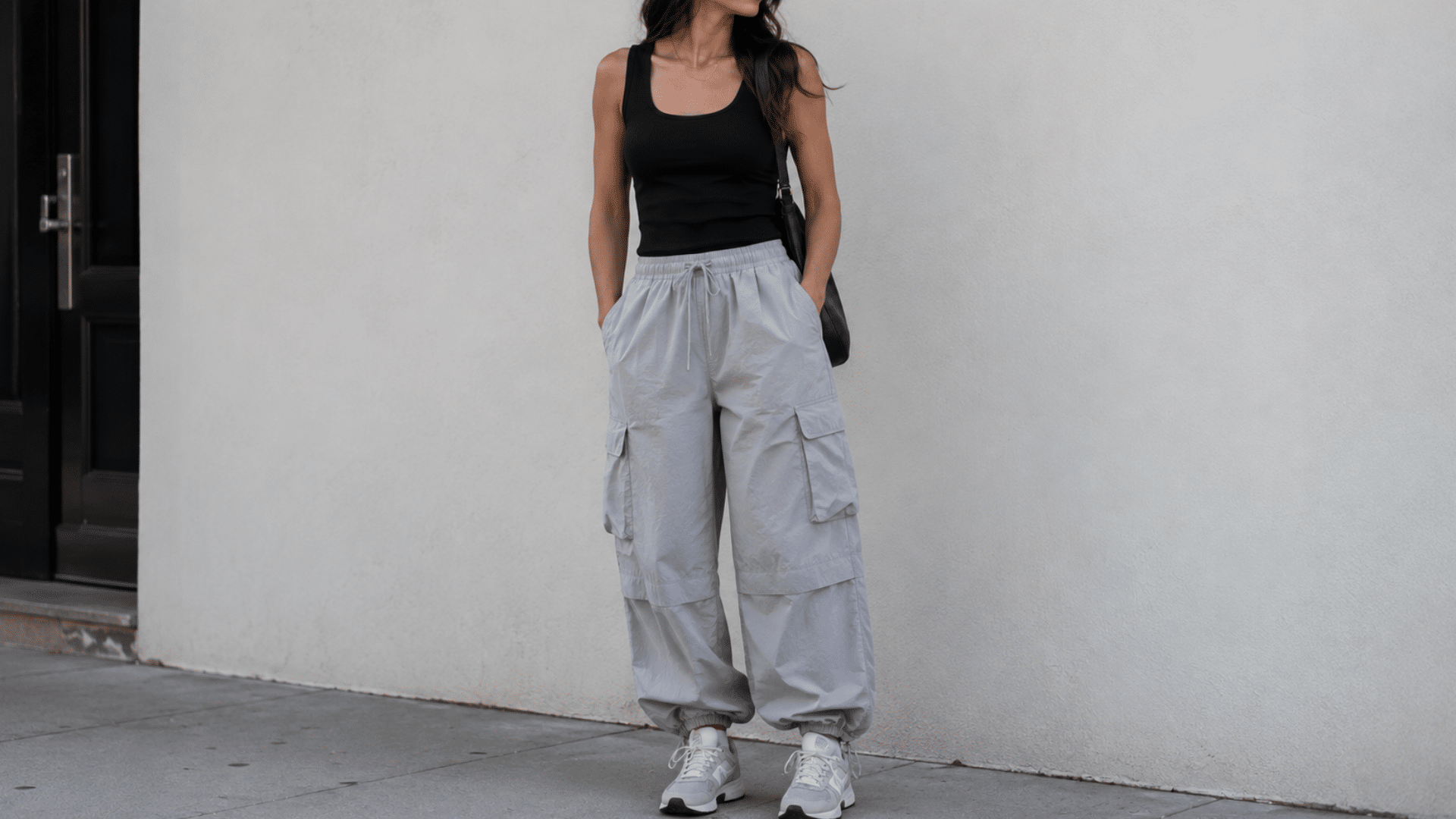 Parachute cargos with a fitted tank and sneakers for a relaxed outfit that balances soft volume with a neat upper half
