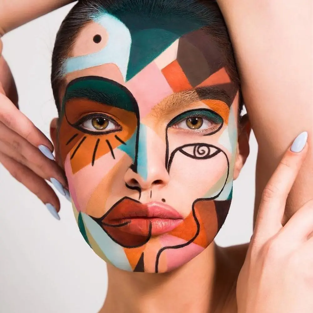 Picasso inspired makeup with relocated facial features, black outlines, flat bright color shapes, and cubist design