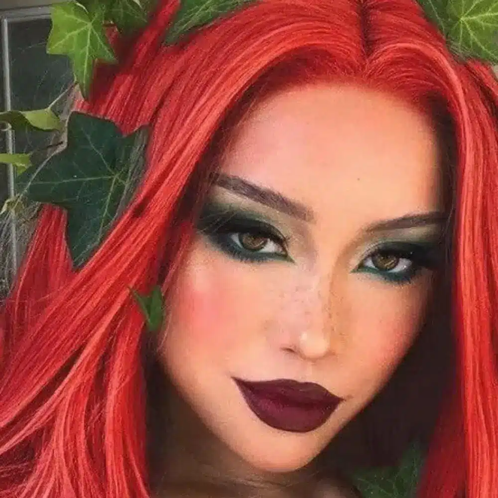 Poison Ivy makeup with layered green shadow, vine and leaf details, black winged liner, shimmer, and green lipstick