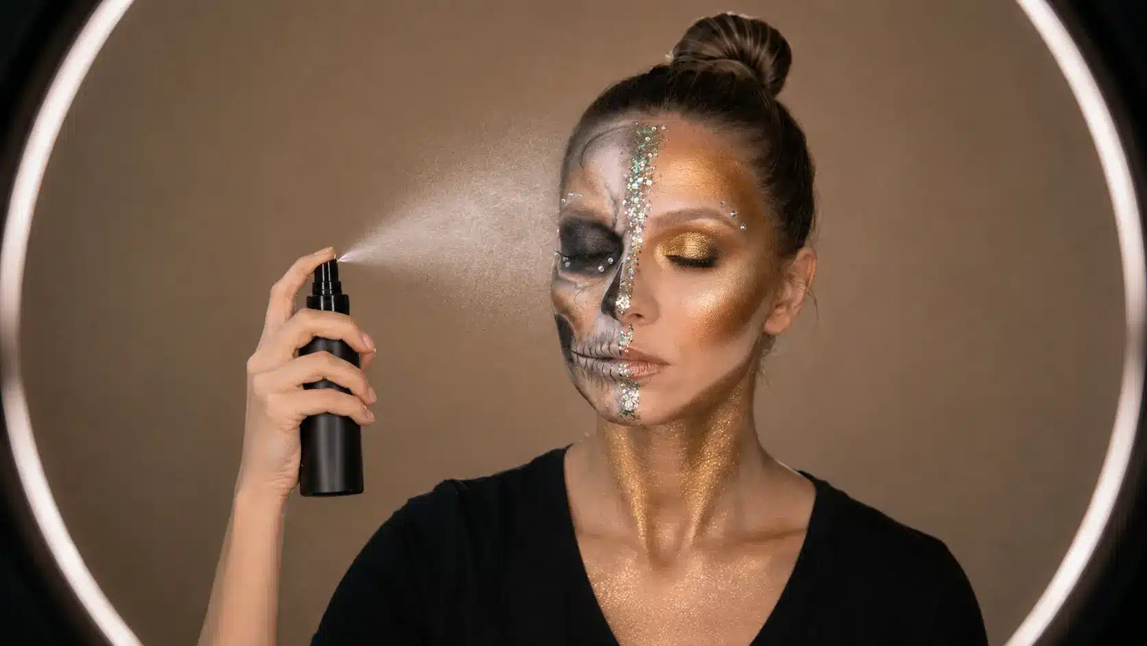 Final half skull makeup look with one side featuring detailed skull face paint and the other side finished with glamorous beauty makeup
