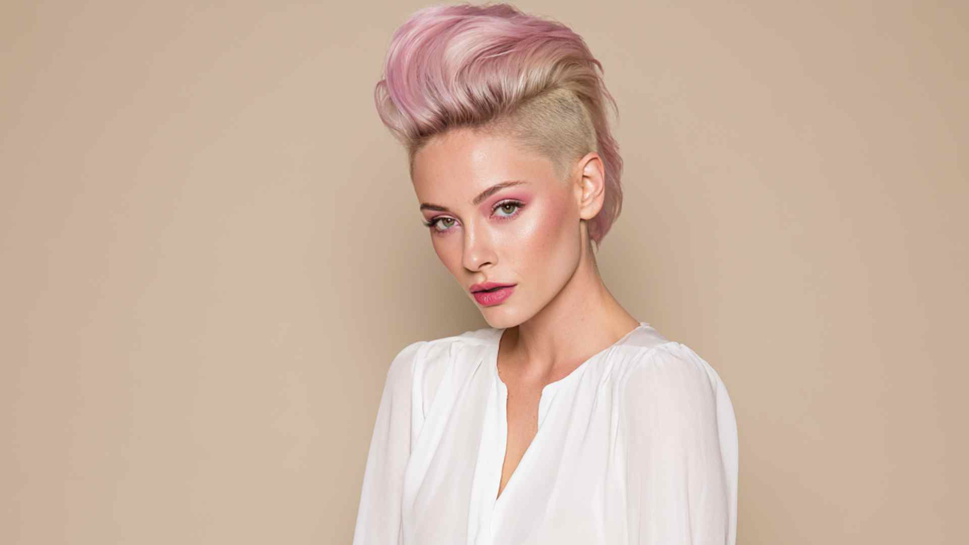 Short mohawk with shaved sides and a narrow strip of longer hair through the center