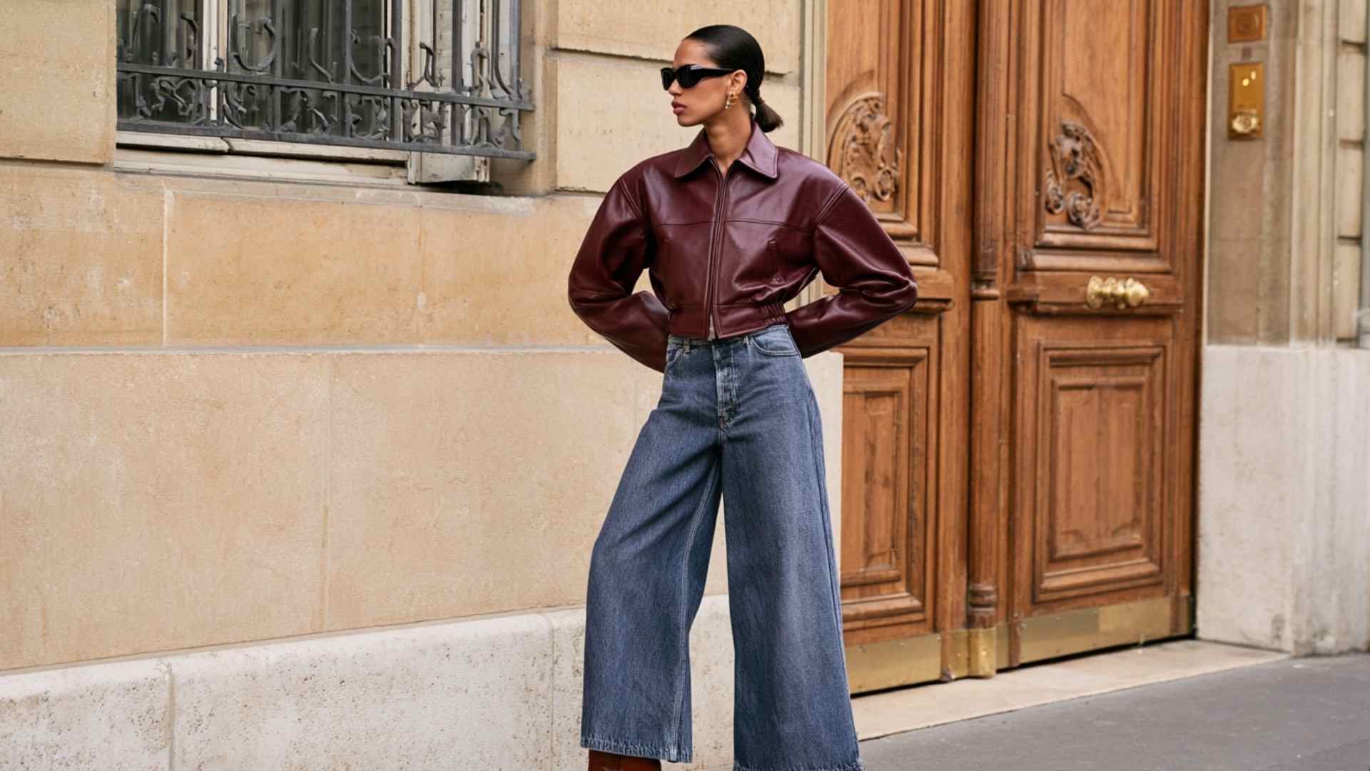 Wide leg jeans with a cropped sweater and burgundy coat for winter