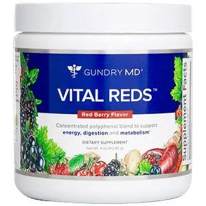 Container of Vital Reds dietary supplement with colorful fruit illustrations on the label
